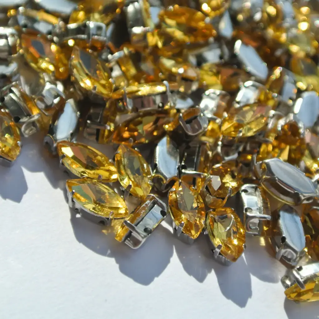 ENGARZADAS - NAVETTE - TOPAZ C/ METAL SILVER - 5X10 (x100)